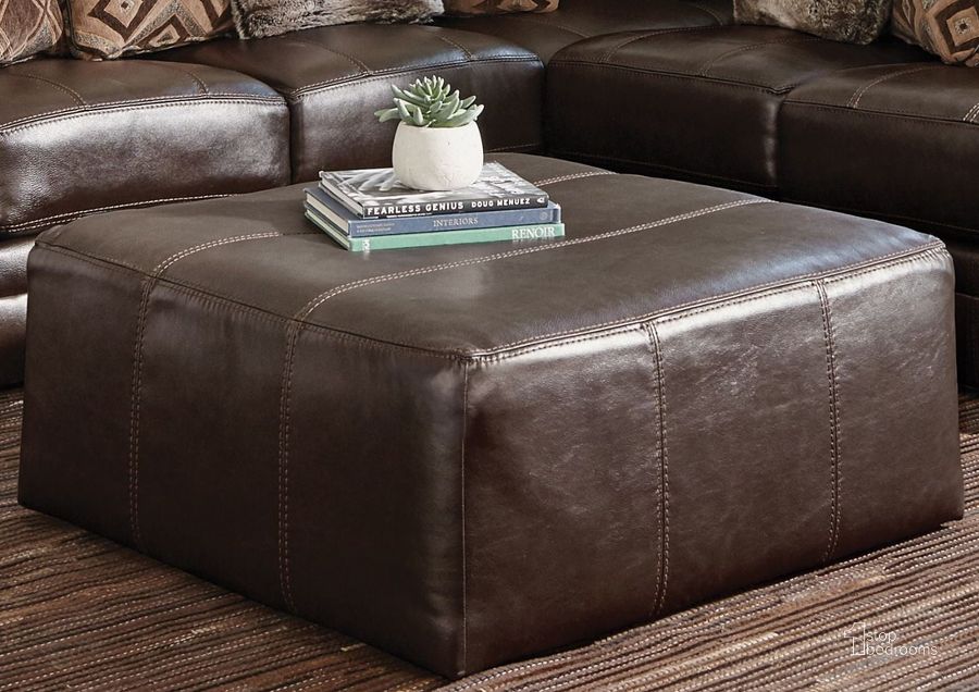 The appearance of Denali Chocolate Cocktail Ottoman designed by Jackson in the transitional interior design. This brown piece of furniture  was selected by 1StopBedrooms from Denali Collection to add a touch of cosiness and style into your home. Sku: 4378-28-1283/09-3083/09. Product Type: Ottoman. Material: Vinyl. Image1