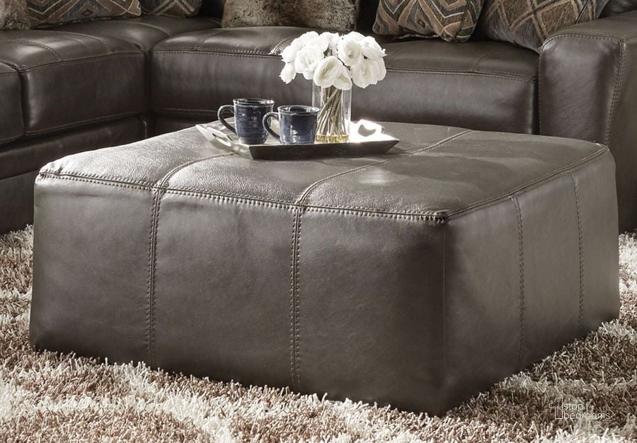 The appearance of Denali Steel Cocktail Ottoman designed by Jackson in the transitional interior design. This gray piece of furniture  was selected by 1StopBedrooms from Denali Collection to add a touch of cosiness and style into your home. Sku: 437828128328308328. Product Type: Ottoman. Material: Vinyl. Image1