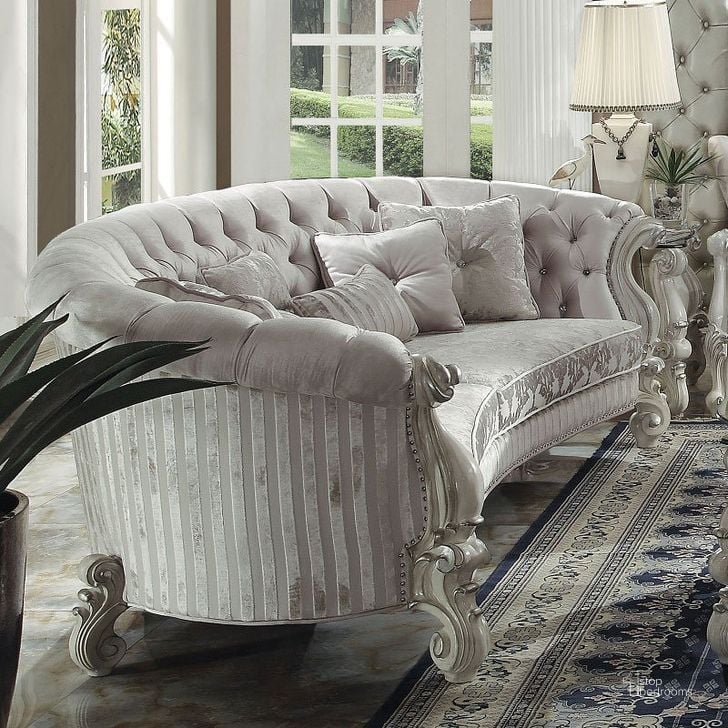 The appearance of Versailles Crescent Sofa (Ivory Velvet) designed by ACME in the rustic / southwestern interior design. This white piece of furniture  was selected by 1StopBedrooms from Versailles Collection to add a touch of cosiness and style into your home. Sku: 52085. Material: Fabric. Product Type: Sofa. Key Features: Tufted.