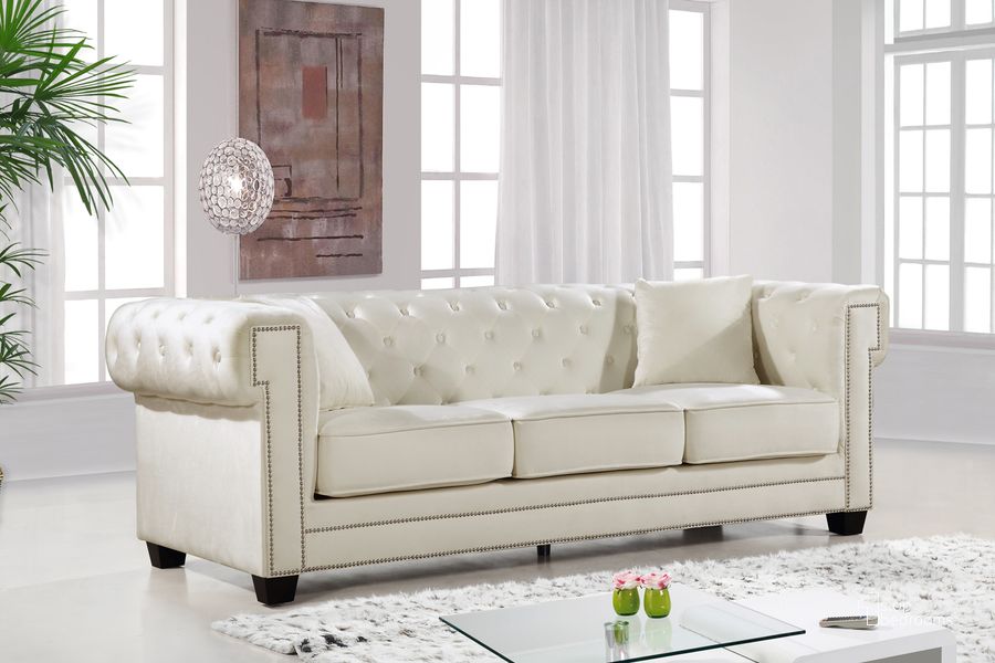 The appearance of Meridian Bowery Velvet Sofa in Cream 614Cream-S designed by Meridian in the modern / contemporary interior design. This cream velvet piece of furniture  was selected by 1StopBedrooms from Bowery Collection to add a touch of cosiness and style into your home. Sku: 614Cream-S. Material: Fabric. Product Type: Sofa. Image1