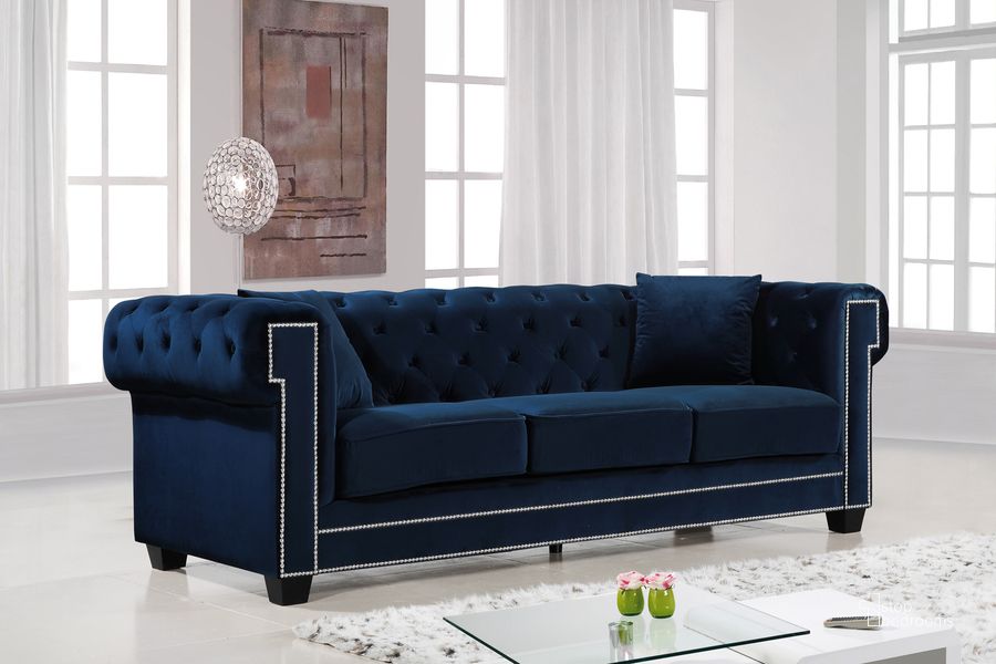 The appearance of Meridian Bowery Velvet Sofa in Navy 614Navy-S designed by Meridian in the modern / contemporary interior design. This navy velvet piece of furniture  was selected by 1StopBedrooms from Bowery Collection to add a touch of cosiness and style into your home. Sku: 614Navy-S. Material: Fabric. Product Type: Sofa. Image1