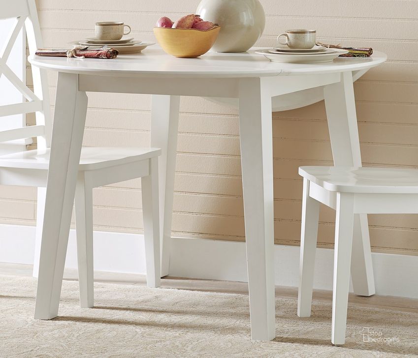 The appearance of Simplicity Round Drop Leaf Table (Paperwhite) designed by Jofran in the transitional interior design. This white piece of furniture  was selected by 1StopBedrooms from Simplicity Collection to add a touch of cosiness and style into your home. Sku: 652-28. Table Base Style: Legs. Table Top Shape: Round. Product Type: Dining Table. Material: Rubberwood.
