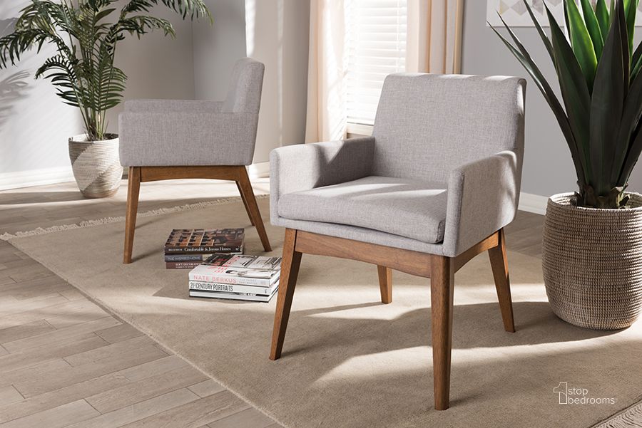 The appearance of Baxton Studio Nexus Mid-Century Modern Walnut Wood Finishing Greyish Beige Fabric Dining Armchair (Set Of 2) designed by Baxton Studio in the transitional interior design. This beige piece of furniture  was selected by 1StopBedrooms from Nexus Collection to add a touch of cosiness and style into your home. Sku: BBT5281-Greyish Beige-DC-H1217-14. Material: Fabric. Product Type: Dining Chair. Image1