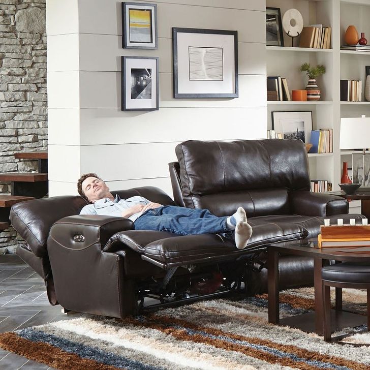The appearance of Wembley Power Lay Flat Reclining Sofa w/ Power Headrest and Lumbar (Chocolate) designed by Catnapper in the modern / contemporary interior design. This chocolate piece of furniture  was selected by 1StopBedrooms from Wembley Collection to add a touch of cosiness and style into your home. Sku: 764581-1283-09. Material: Leather. Product Type: Reclining Sofa.
