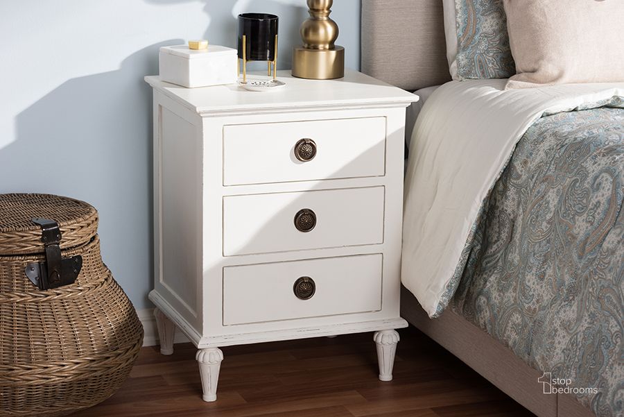 The appearance of Baxton Studio Venezia French-Inspired Rustic Whitewash Wood 3-Drawer Nightstand designed by Baxton Studio in the transitional interior design. This white piece of furniture  was selected by 1StopBedrooms from Venezia Collection to add a touch of cosiness and style into your home. Sku: SED2MCAL2Wa. Material: Wood. Product Type: Nightstand. Image1