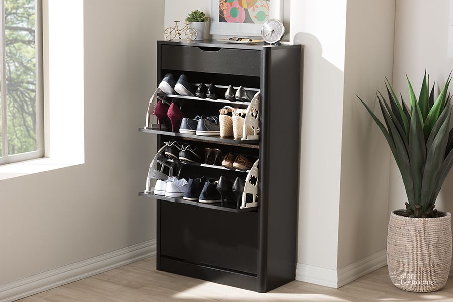 The appearance of Baxton Studio Cayla Modern And Contemporary Black Wood Shoe Cabinet designed by Baxton Studio in the modern / contemporary interior design. This black piece of furniture  was selected by 1StopBedrooms from Cayla Collection to add a touch of cosiness and style into your home. Sku: SESC214-Black-Shoe Cabinet. Material: MDF. Product Type: Entryway Furniture. Image1