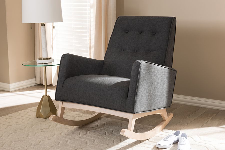 The appearance of Baxton Studio Marlena Mid-Century Modern Dark Grey Fabric Upholstered Whitewash Wood Rocking Chair designed by Baxton Studio in the transitional interior design. This dark grey piece of furniture  was selected by 1StopBedrooms from Marlena Collection to add a touch of cosiness and style into your home. Sku: BBT5308-Dark Grey RC. Material: Fabric. Product Type: Living Room Chair. Image1