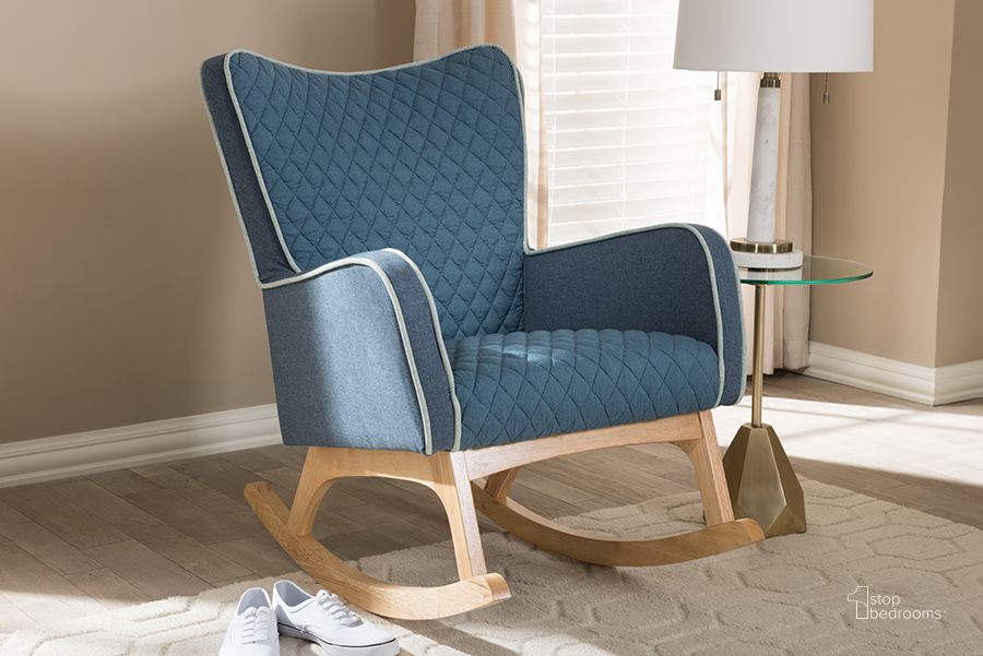 The appearance of Baxton Studio Zoelle Mid-Century Modern Blue Fabric Upholstered Natural Finished Rocking Chair designed by Baxton Studio in the transitional interior design. This blue piece of furniture  was selected by 1StopBedrooms from Zoelle Collection to add a touch of cosiness and style into your home. Sku: BBT5305-Blue-RC. Material: Fabric. Product Type: Living Room Chair. Image1
