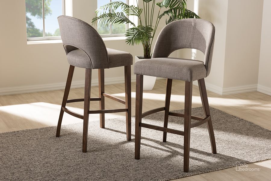 The appearance of Baxton Studio Melrose Mid-Century Modern Light Grey Fabric Upholstered Walnut Finished Wood Bar Stool (Set Of 2) designed by Baxton Studio in the transitional interior design. This light grey piece of furniture  was selected by 1StopBedrooms from Melrose Collection to add a touch of cosiness and style into your home. Sku: Melrose-Light Grey-BS. Material: Fabric. Product Type: Barstool. Image1