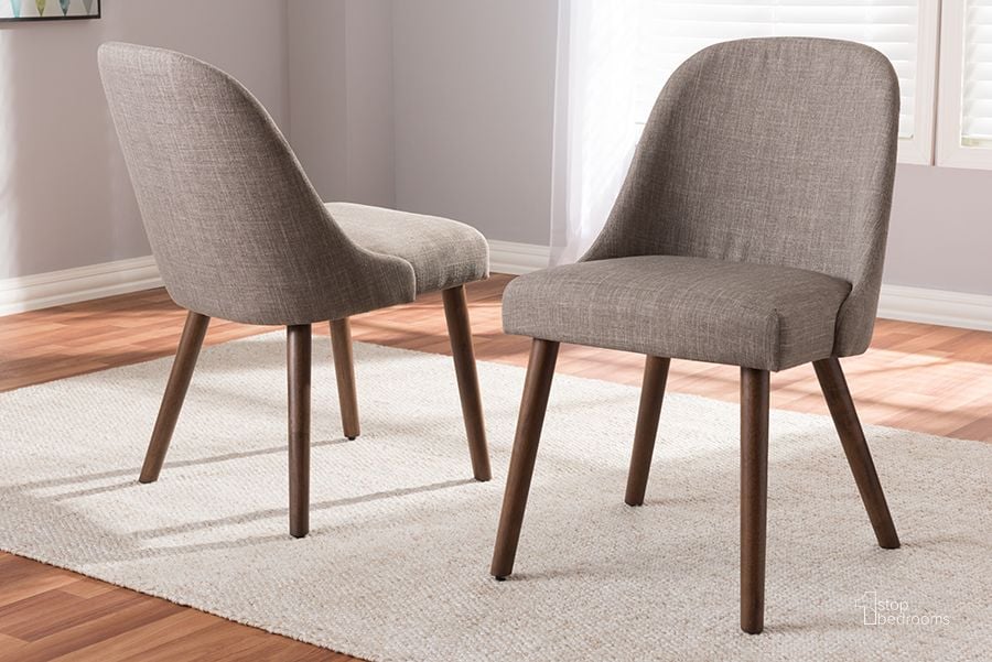 The appearance of Baxton Studio Cody Mid-Century Modern Light Grey Fabric Upholstered Walnut Finished Wood Dining Chair (Set Of 2) designed by Baxton Studio in the transitional interior design. This light grey piece of furniture  was selected by 1StopBedrooms from Cody Collection to add a touch of cosiness and style into your home. Sku: Cody-Light Grey-DC. Material: Fabric. Product Type: Dining Chair. Image1