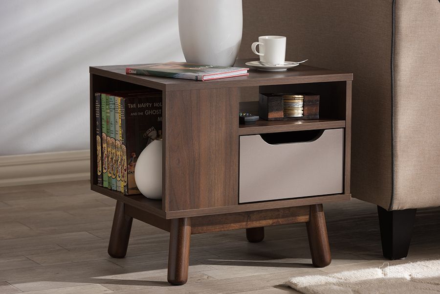 The appearance of Baxton Studio Britta Mid-Century Modern Walnut Brown And Grey Two-Tone Finished Wood Nightstand designed by Baxton Studio in the transitional interior design. This brown piece of furniture  was selected by 1StopBedrooms from Britta Collection to add a touch of cosiness and style into your home. Sku: ST 2847-00-Brown/Grey-NS. Product Type: Nightstand. Material: MDF. Image1