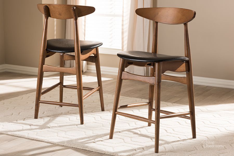 The appearance of Sinclair Mills Black Barstool Set of 2 0qb2355067 designed by Isaac Tahari in the transitional interior design. This black piece of furniture  was selected by 1StopBedrooms from Sinclair Mills Collection to add a touch of cosiness and style into your home. Sku: Flora-Black/Walnut-Counter Stool. Product Type: Barstool. Material: Rubberwood. Image1