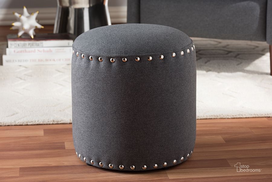 The appearance of Baxton Studio Rosine Modern And Contemporary Dark Grey Fabric Upholstered Nail Trim Ottoman designed by Baxton Studio in the modern / contemporary interior design. This grey piece of furniture  was selected by 1StopBedrooms from Rosine Collection to add a touch of cosiness and style into your home. Sku: 1708-Gray. Material: Fabric. Product Type: Ottoman. Image1