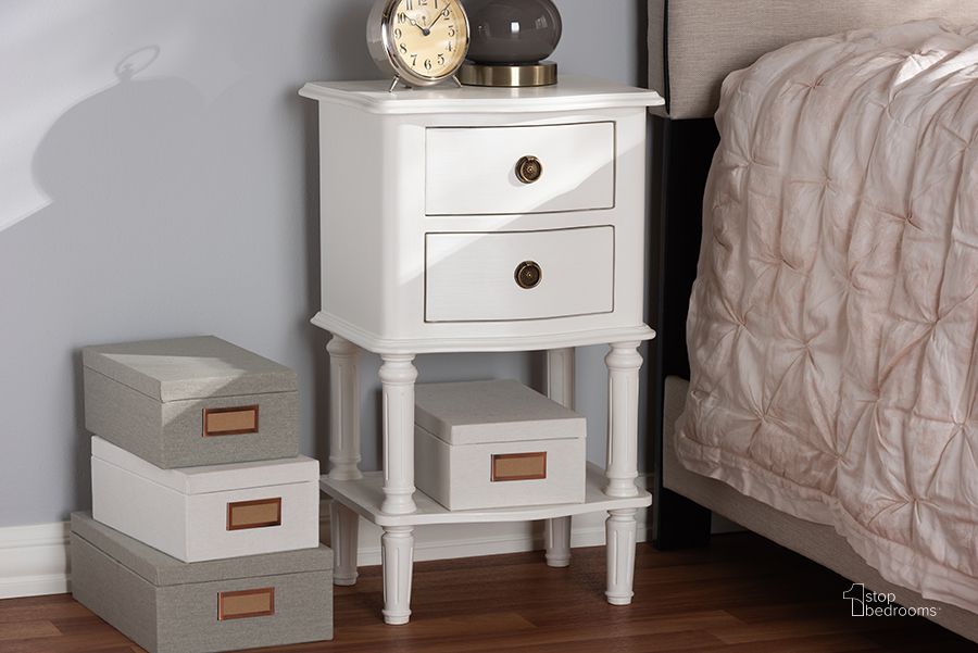 The appearance of Baxton Studio Audrey Country Cottage Farmhouse White Finished 2-Drawer Nightstand designed by Baxton Studio in the modern / contemporary interior design. This white piece of furniture  was selected by 1StopBedrooms from Audrey Collection to add a touch of cosiness and style into your home. Sku: GLA5-White-NS. Material: Wood. Product Type: Nightstand. Image1