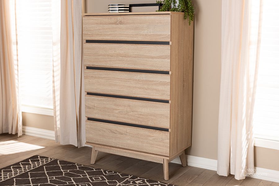 The appearance of Baxton Studio Miren Mid-Century Modern Light Oak And Dark Grey 5-Drawer Chest designed by Baxton Studio in the transitional interior design. This oak piece of furniture  was selected by 1StopBedrooms from Miren Collection to add a touch of cosiness and style into your home. Sku: SECOD5014-Hana Oak/Dark Grey-5DW-Chest. Product Type: Chest. Material: MDF. Image1