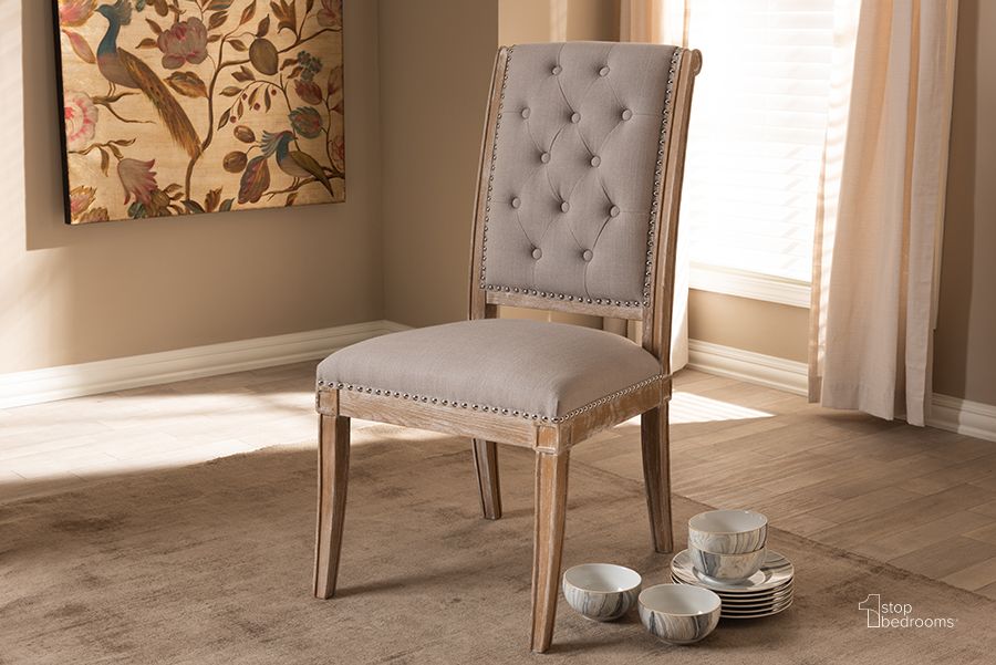 The appearance of Baxton Studio Charmant French Provincial Beige Fabric Upholstered Weathered Oak Finished Wood Dining Chair designed by Baxton Studio in the transitional interior design. This beige piece of furniture  was selected by 1StopBedrooms from Charmant Collection to add a touch of cosiness and style into your home. Sku: TSF-7711-Beige-DC. Material: Fabric. Product Type: Dining Chair. Image1