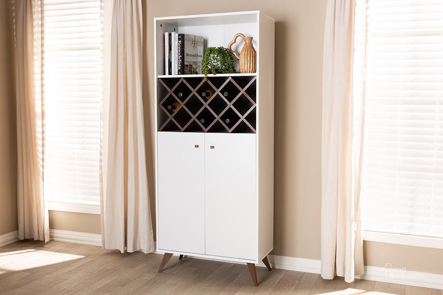 The appearance of Baxton Studio Serafino Mid-Century Modern White And Walnut Finished Wood Wine Cabinet designed by Baxton Studio in the transitional interior design. This white piece of furniture  was selected by 1StopBedrooms from Serafino Collection to add a touch of cosiness and style into your home. Sku: SEWC16001WI-White/Columbia. Product Type: Wine Cabinet. Material: MDF. Image1