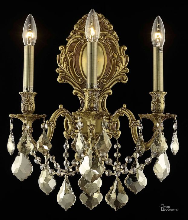 The appearance of Monarch 14 French Gold 3 Light Wall Sconce With Golden Teak Royal Cut Crystal Trim designed by Elegant Lighting in the glam interior design. This gold piece of furniture  was selected by 1StopBedrooms from Monarch Collection to add a touch of cosiness and style into your home. Sku: 9603W14FG-GT/RC. Product Type: Wall Sconce. Material: Crystal.