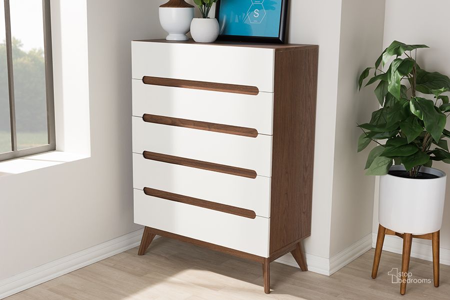 The appearance of Baxton Studio Calypso Mid-Century Modern White And Walnut Wood 5-Drawer Storage Chest designed by Baxton Studio in the transitional interior design. This white piece of furniture  was selected by 1StopBedrooms from Calypso Collection to add a touch of cosiness and style into your home. Sku: Calypso-Walnut/White-5DW-Chest. Product Type: Chest. Material: MDF. Image1