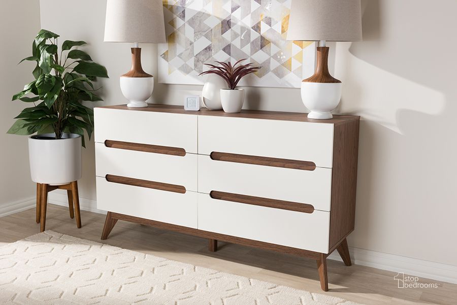 The appearance of Baxton Studio Calypso Mid-Century Modern White And Walnut Wood 6-Drawer Storage Dresser designed by Baxton Studio in the transitional interior design. This white piece of furniture  was selected by 1StopBedrooms from Calypso Collection to add a touch of cosiness and style into your home. Sku: Calypso-Walnut/White-6DW-Chest. Product Type: Chest. Material: MDF. Image1