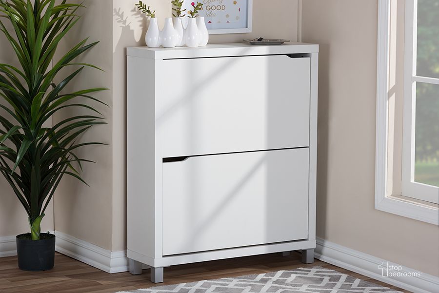 The appearance of Baxton Studio Simms White Modern Shoe Cabinet FP-2OUS-White designed by Baxton Studio in the transitional interior design. This white piece of furniture  was selected by 1StopBedrooms from Simms Collection to add a touch of cosiness and style into your home. Sku: FP-2OUS-White. Material: Wood. Product Type: Shoe Cabinet. Image1