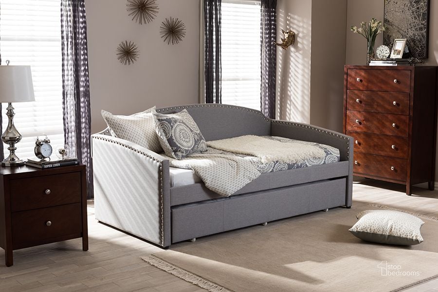 The appearance of Baxton Studio Lanny Modern And Contemporary Grey Fabric Nail Heads Trimmed Arched Back Sofa Twin Daybed With Roll-Out Trundle Guest Bed designed by Baxton Studio in the modern / contemporary interior design. This grey piece of furniture  was selected by 1StopBedrooms from Lanny Collection to add a touch of cosiness and style into your home. Sku: Lanny-Grey-Daybed. Bed Type: Daybed. Material: Fabric. Product Type: DayBed. Bed Size: Twin. Image1