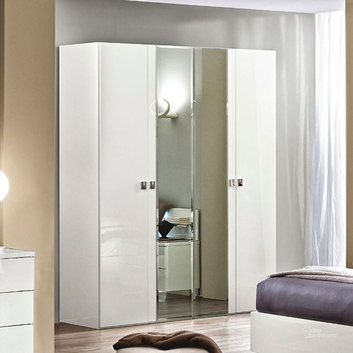The appearance of Onda 4 Door Wardrobe (White) designed by ESF in the modern / contemporary interior design. This white piece of furniture  was selected by 1StopBedrooms from Onda Collection to add a touch of cosiness and style into your home. Sku: ONDA4DOORWHITE. Material: MDF. Product Type: Armoires and Wardrobe.