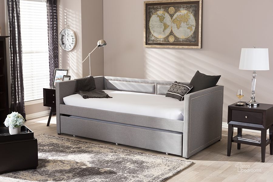 The appearance of Baxton Studio Raymond Modern And Contemporary Grey Fabric Nail Heads Trimmed Sofa Twin Daybed With Roll-Out Trundle Guest Bed designed by Baxton Studio in the modern / contemporary interior design. This grey piece of furniture  was selected by 1StopBedrooms from Raymond Collection to add a touch of cosiness and style into your home. Sku: Raymond-Grey-Daybed. Bed Type: Daybed. Material: Fabric. Product Type: DayBed. Bed Size: Twin. Image1