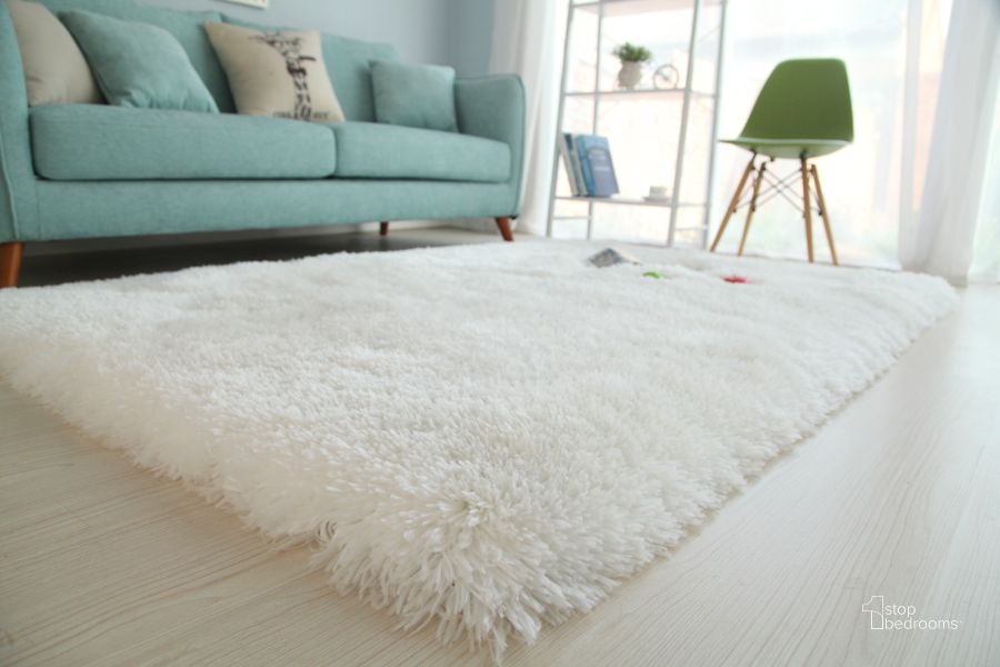 The appearance of Snow White Extra Long Shaggy Area Rug 5 x 7 designed by Amazing Rugs in the modern / contemporary interior design. This white piece of furniture  was selected by 1StopBedrooms from Shaggy Collection to add a touch of cosiness and style into your home. Sku: SN4001-57. Material: Polyester. Product Type: Area Rugs. Image1