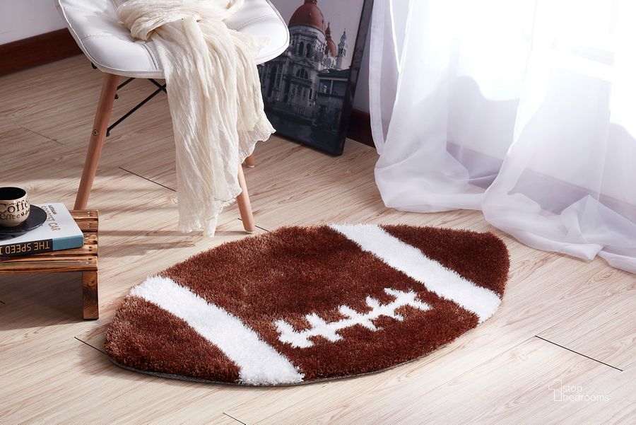 The appearance of Football Extra Soft Shaggy Area Rug 36" Diameter designed by Amazing Rugs in the modern / contemporary interior design. This brown piece of furniture  was selected by 1StopBedrooms from Shaggy Collection to add a touch of cosiness and style into your home. Sku: SR1011. Material: Polyester. Product Type: Area Rugs. Image1