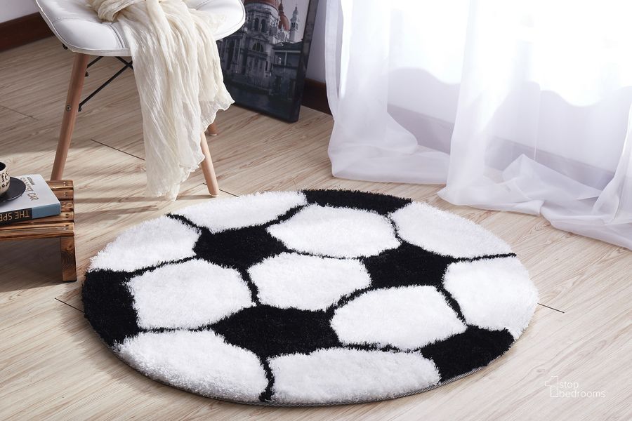 The appearance of Soccer Extra Soft Shaggy Area Rug 36" Diameter designed by Amazing Rugs in the modern / contemporary interior design. This black and white piece of furniture  was selected by 1StopBedrooms from Shaggy Collection to add a touch of cosiness and style into your home. Sku: SR1013. Material: Polyester. Product Type: Area Rugs. Image1