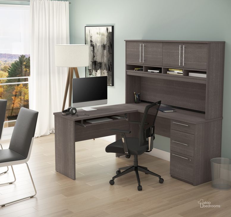 The appearance of Innova Plus L-Shaped Desk In Bark Gray designed by Bestar in the modern / contemporary interior design. This bark gray piece of furniture  was selected by 1StopBedrooms from Innova Collection to add a touch of cosiness and style into your home. Sku: 92421-47. Material: Wood. Product Type: Office Desk. Image1