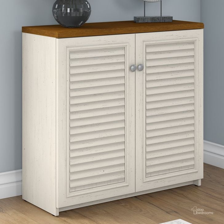 The appearance of Fairview Small Storage Cabinet with Doors in Antique White and Tea Maple designed by Bush Furniture in the country / farmhouse interior design. This antique white piece of furniture  was selected by 1StopBedrooms from Fairview Collection to add a touch of cosiness and style into your home. Sku: WC53296-03. Product Type: Storage Cabinet. Image1