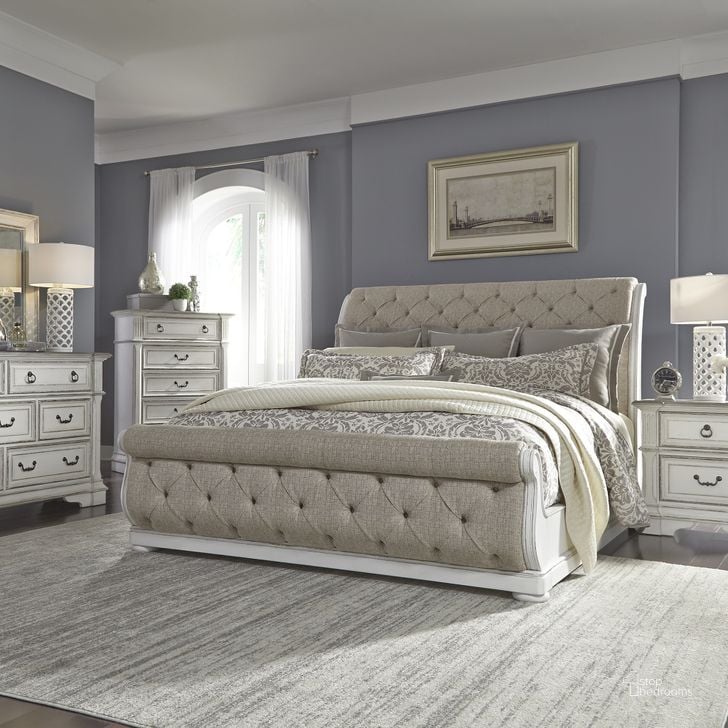 The appearance of Abbey Park Antique White Upholstered Sleigh Bedroom Set designed by Liberty in the traditional interior design. This white piece of furniture  was selected by 1StopBedrooms from Abbey Park Collection to add a touch of cosiness and style into your home. Sku: 520-BR21FU;520-BR21HU;520-BR92;520-BR61. Bed Type: Sleigh Bed. Product Type: Sleigh Bed. Bed Size: Queen. Material: Rubberwood. Image1