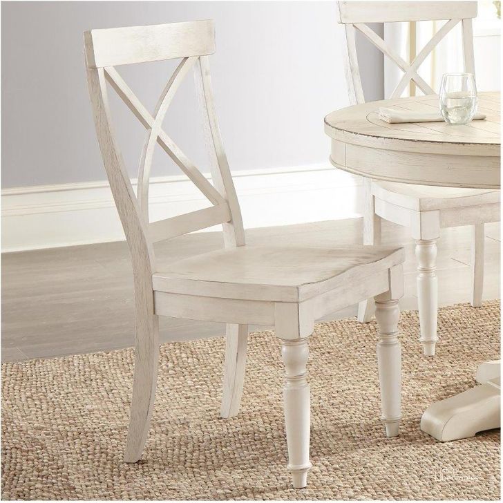 The appearance of Aberdeen Weathered Worn White X Back Side Chair Set of 2 designed by Riverside Furniture in the transitional interior design. This white piece of furniture  was selected by 1StopBedrooms from Aberdeen Collection to add a touch of cosiness and style into your home. Sku: 21258. Product Type: Side Chair. Image1