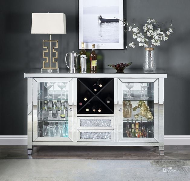 The appearance of Acme Noralie Wine Cabinet With Led In Mirrored And Faux Diamonds AC00525 designed by ACME in the glam interior design. This mirrored piece of furniture  was selected by 1StopBedrooms from Noralie Collection to add a touch of cosiness and style into your home. Sku: AC00525. Material: Wood. Product Type: Wine Cabinet. Image1