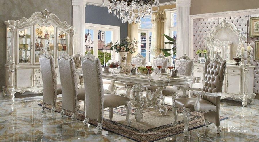 The appearance of Acme Versailles 9-Piece Pedestal Dining Set in Bone White designed by ACME in the rustic / southwestern interior design. This white piece of furniture  was selected by 1StopBedrooms from Versailles Collection to add a touch of cosiness and style into your home. Sku: 61130T;61131ST;61132;61133. Table Base Style: Trestle. Table Top Style: Wood w/extension. Material: Wood. Product Type: Dining Room Set. Table Top Shape: Rectangular. Image1