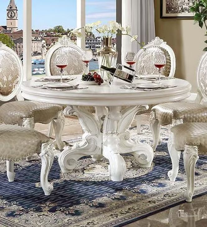 The appearance of Acme Versailles Round Dining Table With Single Pedestal In White designed by ACME in the transitional interior design. This white piece of furniture  was selected by 1StopBedrooms from Versailles Collection to add a touch of cosiness and style into your home. Sku: DN01388-1;DN01388-2. Table Base Style: Pedestal. Table Top Shape: Round. Material: Wood. Product Type: Dining Table. Image1