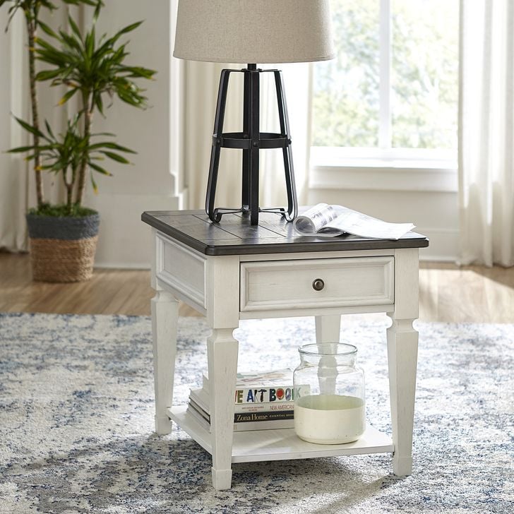 The appearance of Allyson Park Wirebrushed White Drawer End Table designed by Liberty in the country / farmhouse interior design. This white piece of furniture  was selected by 1StopBedrooms from Allyson Park Collection to add a touch of cosiness and style into your home. Sku: 417-OT1020. Product Type: End Table. Material: Pine. Image1