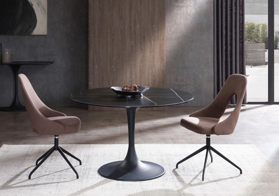 The appearance of Amarosa Round Dining Table In Black designed by Whiteline Modern Living in the modern / contemporary interior design. This black piece of furniture  was selected by 1StopBedrooms from Amarosa Collection to add a touch of cosiness and style into your home. Sku: DT1719-BLK. Table Base Style: Pedestal. Table Top Shape: Round. Product Type: Dining Table. Material: Ceramic. Size: 47.