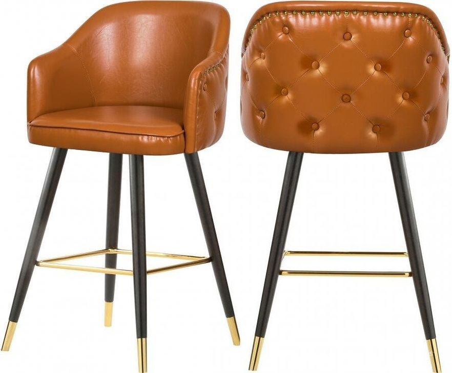 The appearance of Amersfort Cognac Barstool Set of 2 designed by Furnique in the modern / contemporary interior design. This cognac piece of furniture  was selected by 1StopBedrooms from Amersfort Collection to add a touch of cosiness and style into your home. Sku: 900Cognac-C. Material: Faux Leather. Product Type: Barstool. Image1