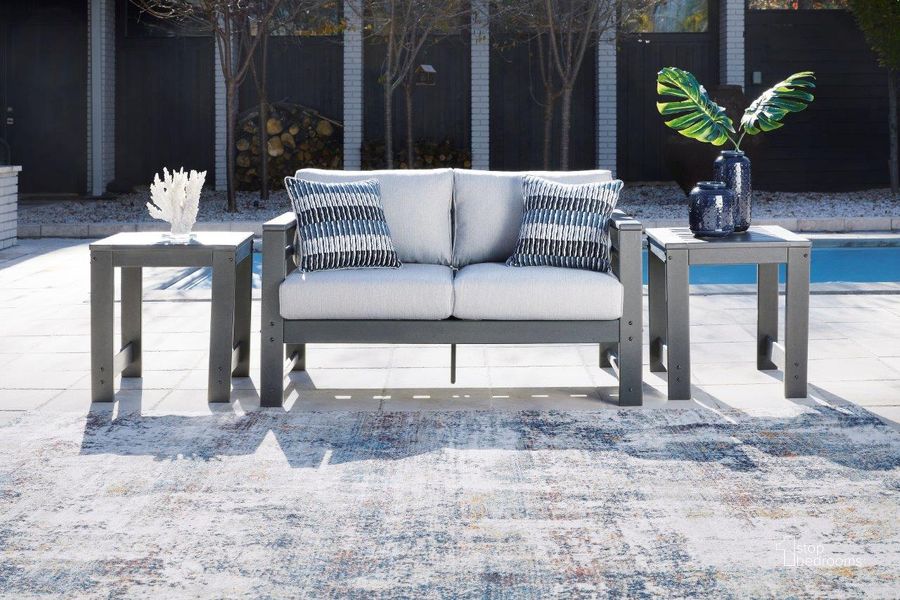 The appearance of Amora Charcoal Gray Outdoor Loveseat designed by Signature Design by Ashley in the transitional interior design. This charcoal gray piece of furniture  was selected by 1StopBedrooms from Amora Collection to add a touch of cosiness and style into your home. Sku: P417-835. Product Type: Outdoor Loveseat. Image1