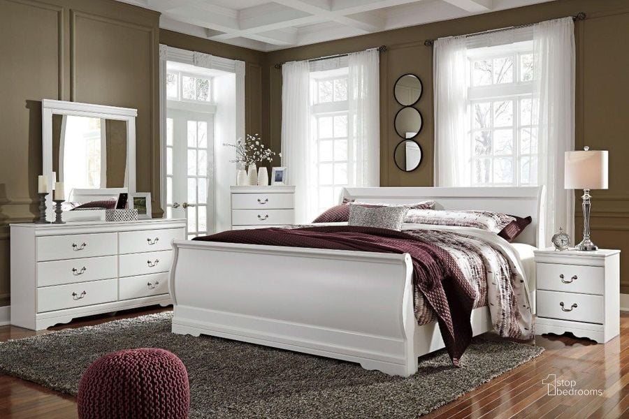 The appearance of Anarasia White Sleigh Bedroom Set designed by Signature Design by Ashley in the modern / contemporary interior design. This white piece of furniture  was selected by 1StopBedrooms from Anarasia Collection to add a touch of cosiness and style into your home. Sku: B129-77;B129-74;B129-98;B129-92. Bed Type: Sleigh Bed. Material: Wood. Product Type: Sleigh Bed. Bed Size: Queen. Image1