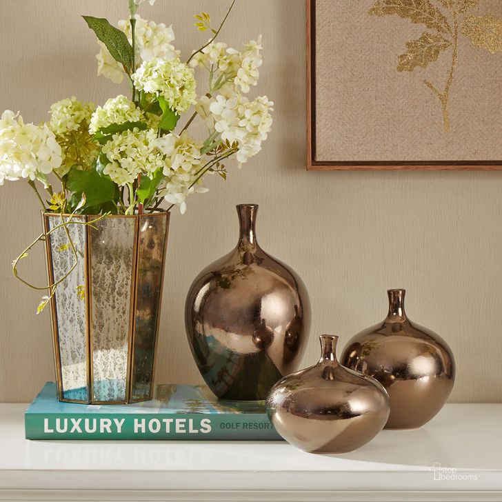 The appearance of Ansen Metallic Vase 3 Piece Set In Bronze designed by Olliix in the transitional interior design. This bronze piece of furniture  was selected by 1StopBedrooms from Ansen Collection to add a touch of cosiness and style into your home. Sku: MPS167-211. Material: Ceramic. Product Type: Vase. Image1