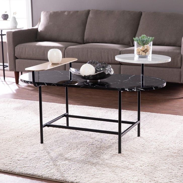 The appearance of Arcklid Faux Marble Cocktail Table With Storage designed by SEI Furniture in the modern / contemporary interior design. This black piece of furniture  was selected by 1StopBedrooms from Arcklid Collection to add a touch of cosiness and style into your home. Sku: CK1114800. Material: Wood. Product Type: Cocktail Table. Image1