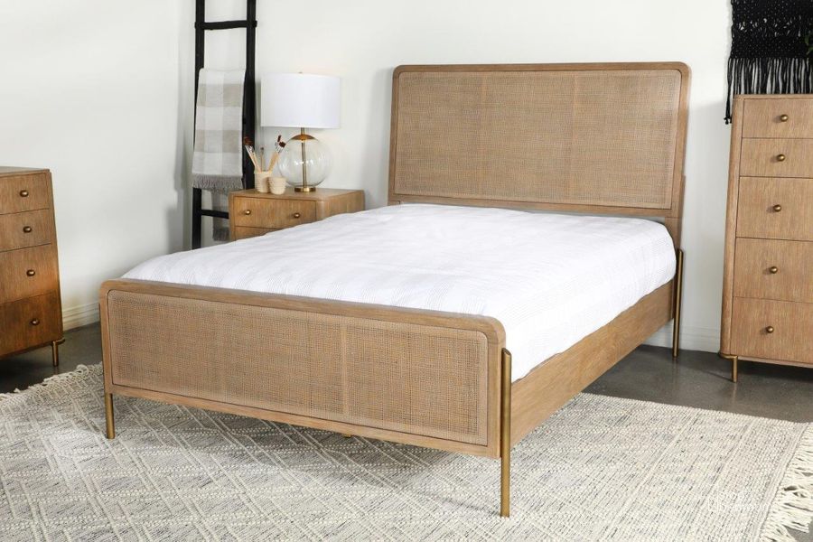The appearance of Arini Upholstered Eastern King Panel Bed Sand Wash and Natural Cane designed by Coaster in the transitional interior design. This natural piece of furniture  was selected by 1StopBedrooms from Arini Collection to add a touch of cosiness and style into your home. Sku: 224300KEB1;224300KEB2;224300KEB3. Bed Type: Panel Bed. Product Type: Panel Bed. Bed Size: King. Material: Plywood. Image1