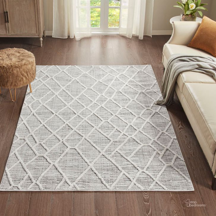 The appearance of Ashley Polyester Terni Pebble Gray Indoor Area Rug In Gray/Cream MP35-7186 designed by Olliix in the modern / contemporary interior design. This gray/cream piece of furniture  was selected by 1StopBedrooms from Ashley Collection to add a touch of cosiness and style into your home. Sku: MP35-7186. Material: Polyester. Product Type: Rug. Image1