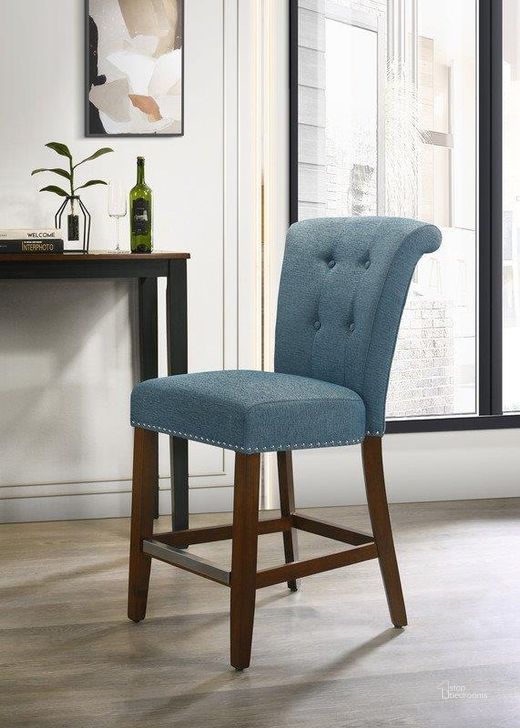 The appearance of Auggie Blue Fabric Counter Height Chair With Nailhead Trim designed by Lilola Home in the modern / contemporary interior design. This blue piece of furniture  was selected by 1StopBedrooms from Auggie Collection to add a touch of cosiness and style into your home. Sku: 30514. Material: Fabric. Product Type: Counter Height Chair. Image1