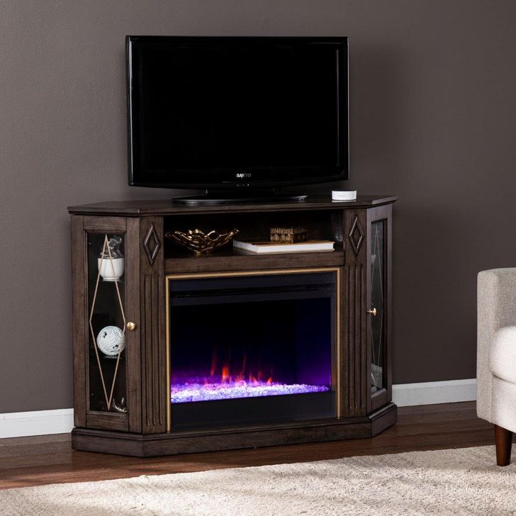 The appearance of Austindale Color Changing Fireplace With Media Storage designed by SEI Furniture in the transitional interior design. This light brown piece of furniture  was selected by 1StopBedrooms from Austindale Collection to add a touch of cosiness and style into your home. Sku: FC1137556. Material: Wood. Product Type: Fireplace. Image1
