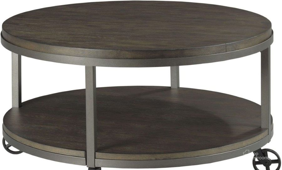 The appearance of Baja II Cocoa Round Coffee Table designed by Hammary in the transitional interior design. This brown piece of furniture  was selected by 1StopBedrooms from Baja II Collection to add a touch of cosiness and style into your home. Sku: 990-911. Material: Wood. Product Type: Coffee Table.